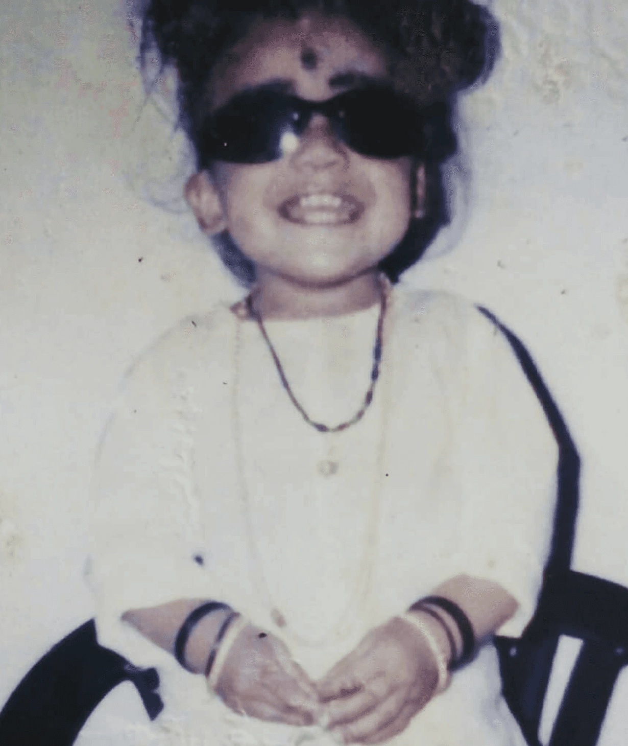 Harish as a child in sunglasses